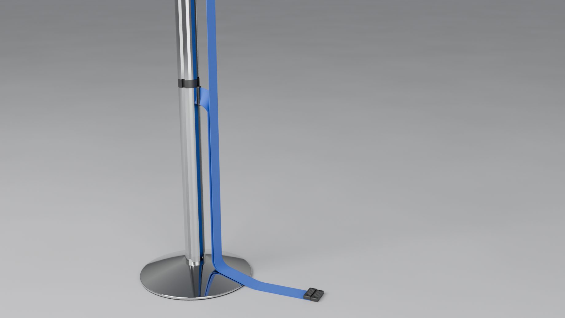 A double belt unhooked from its post, both belts hanging down the tube and ending on the floor